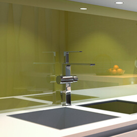 Kitchen sink and tap with green splashback